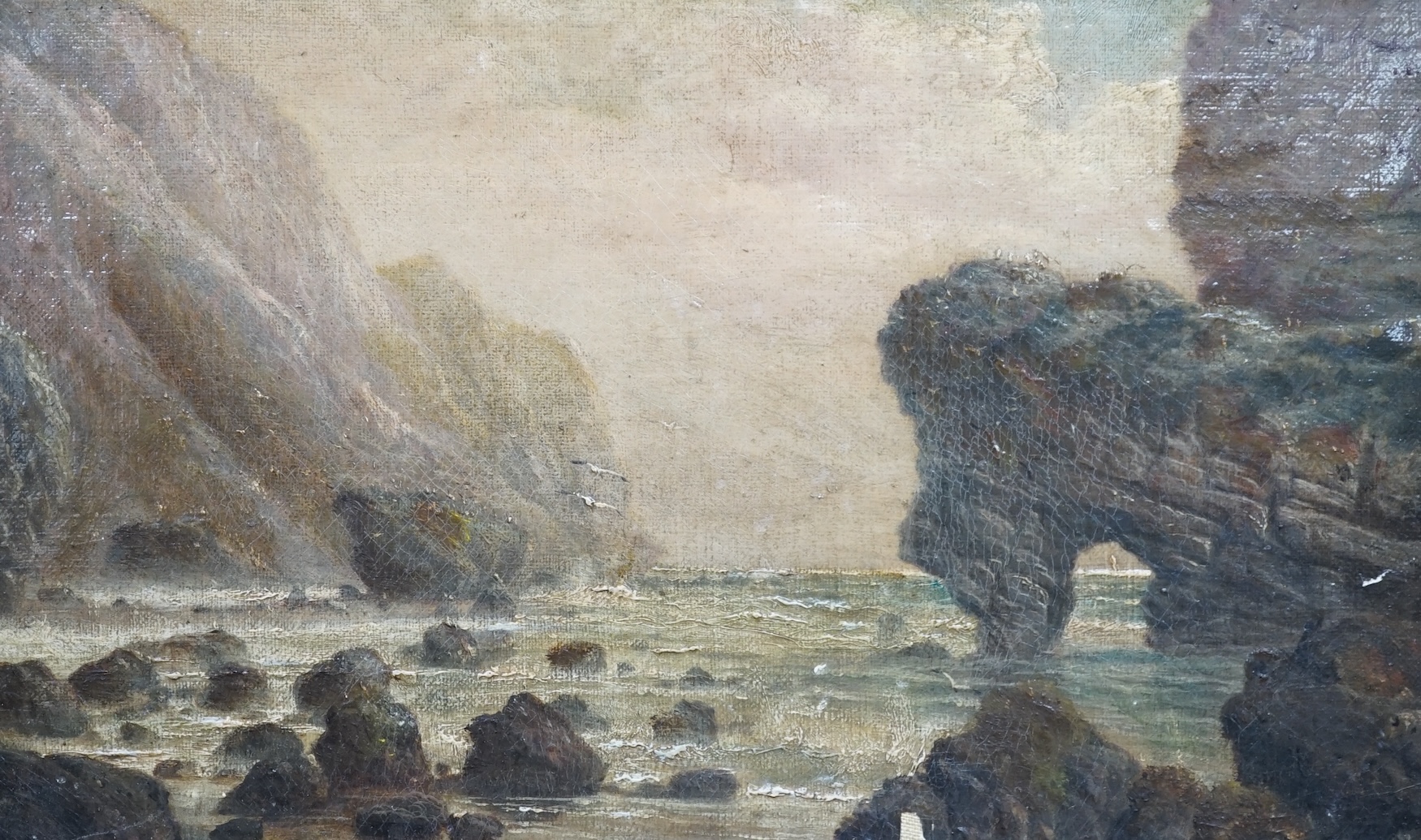 19th century English School, oil on board, Dorset Jurassic coast, showing a coastal rock formation similar to Durdle Door, 18 x 29cm, gilt frame. Condition - fair, some paint chips
